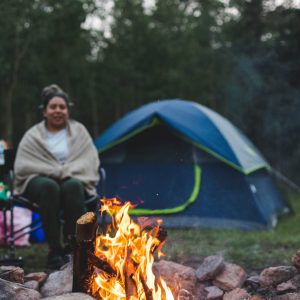 woman-spring-in-front-of-a-campfire-2025-01-09-00-25-39-utc